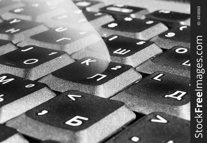 Transparent finger on a laptop keyboard. Transparent finger on a laptop keyboard