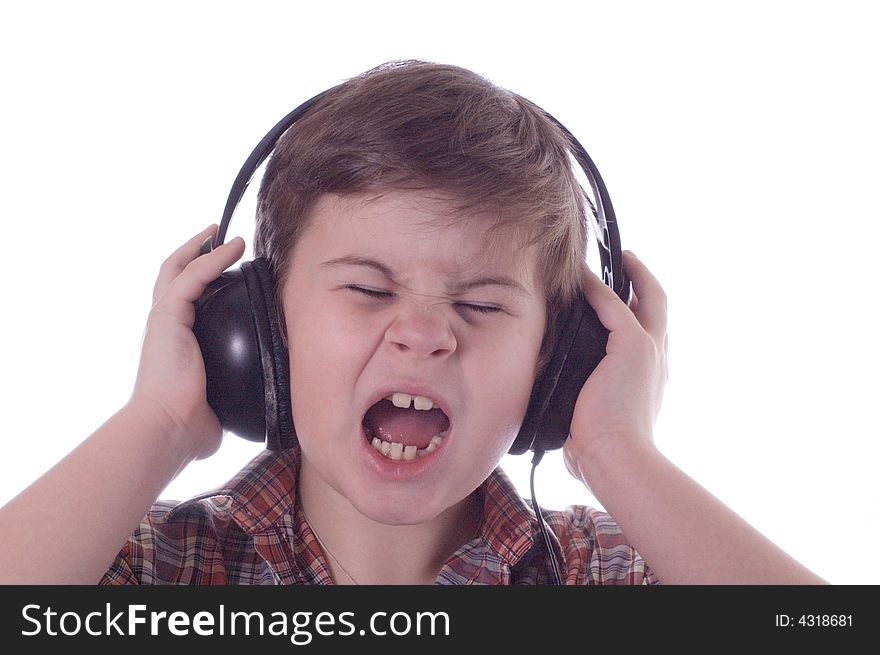 The little boy listens to music and sings a song