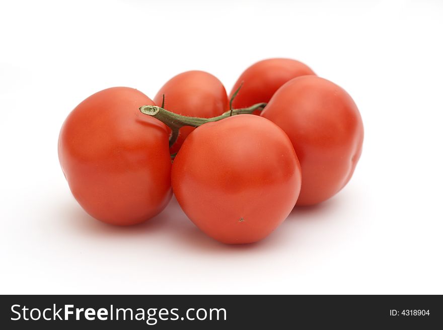 Red tomatoes on a white background