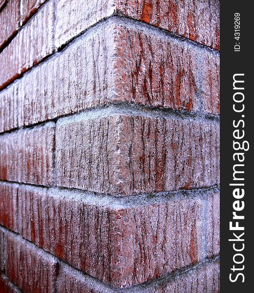 A Red Brick Wall Corner Covered With Ice. A Red Brick Wall Corner Covered With Ice