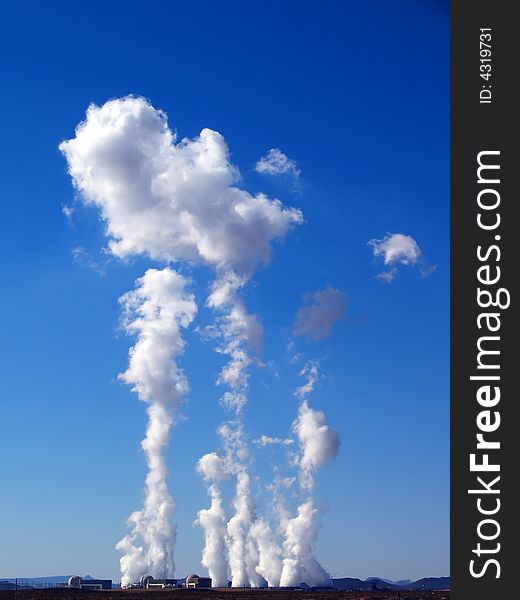 Steam rising into the sky from a desert power-plant. Steam rising into the sky from a desert power-plant