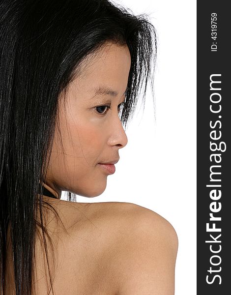 Attractive Asian woman with long black hair looking over her shoulder. Attractive Asian woman with long black hair looking over her shoulder