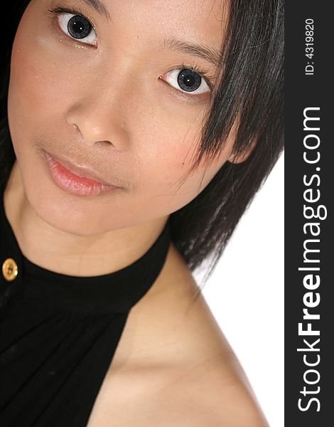 Close-up portrait of beautiful young Asian woman with big grey eyes. Close-up portrait of beautiful young Asian woman with big grey eyes