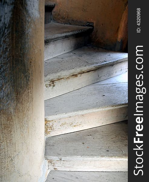 Old wooden spiral stairs in historical building. Old wooden spiral stairs in historical building