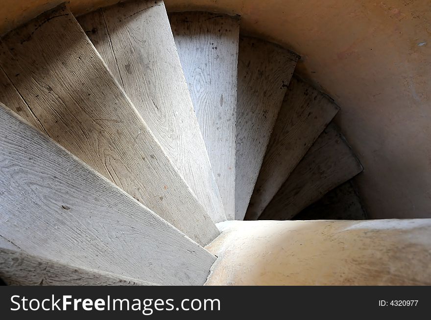 Old wooden spiral stairs in historical building. Old wooden spiral stairs in historical building