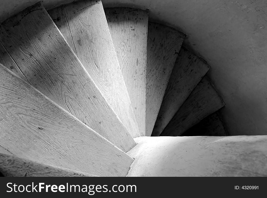 Old wooden spiral stairs in historical building. Old wooden spiral stairs in historical building