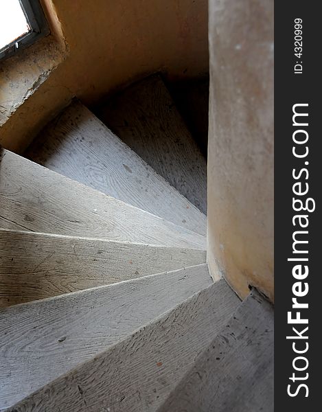 Old wooden spiral stairs in historical building. Old wooden spiral stairs in historical building