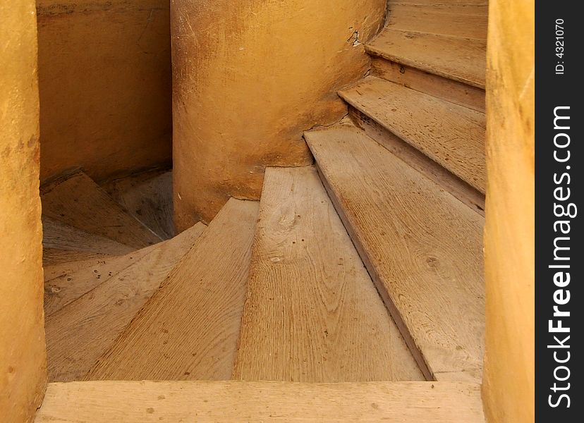 Old wooden spiral stairs in historical building. Old wooden spiral stairs in historical building