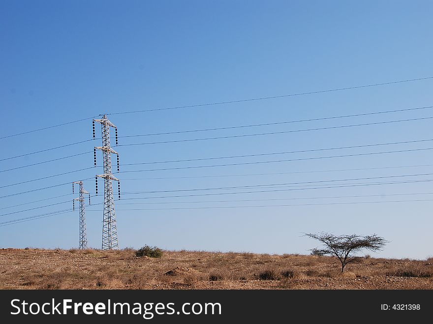 Electrical towers and wires in desert. Electrical towers and wires in desert