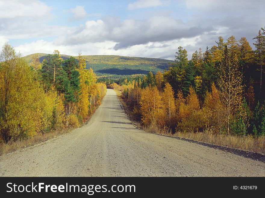 Siberia. The road in the forest not far from Baikal. September. Siberia. The road in the forest not far from Baikal. September.