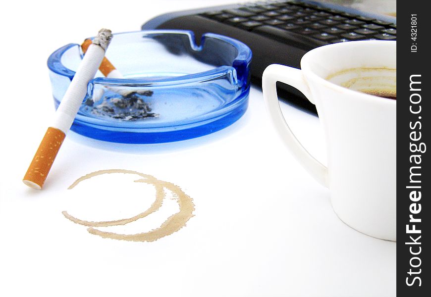 Coffee, cigarette near computer`s keyboard. On white. Coffee, cigarette near computer`s keyboard. On white.