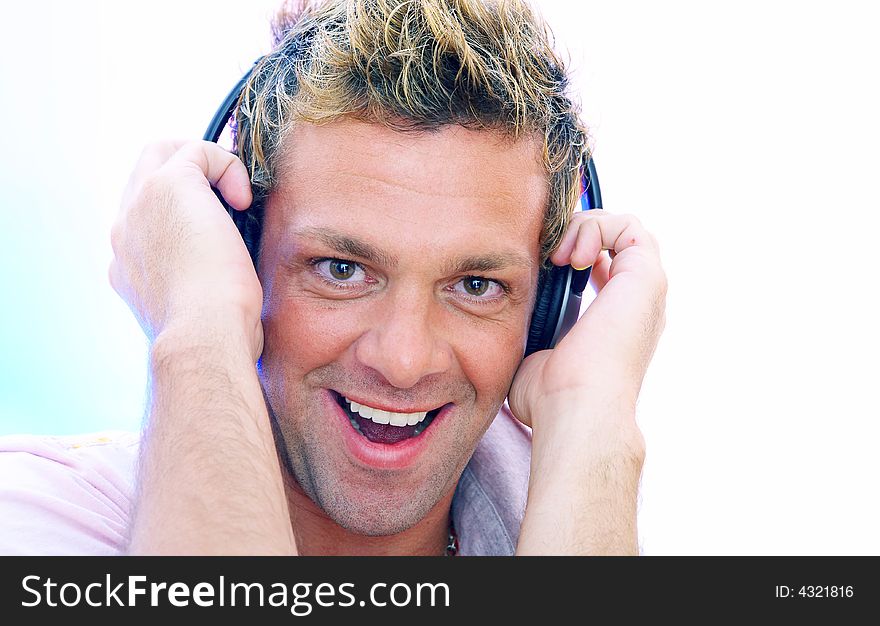 View of young  male listening music via earphones. Image may contain slight multicolor aberration as a part of design. View of young  male listening music via earphones. Image may contain slight multicolor aberration as a part of design