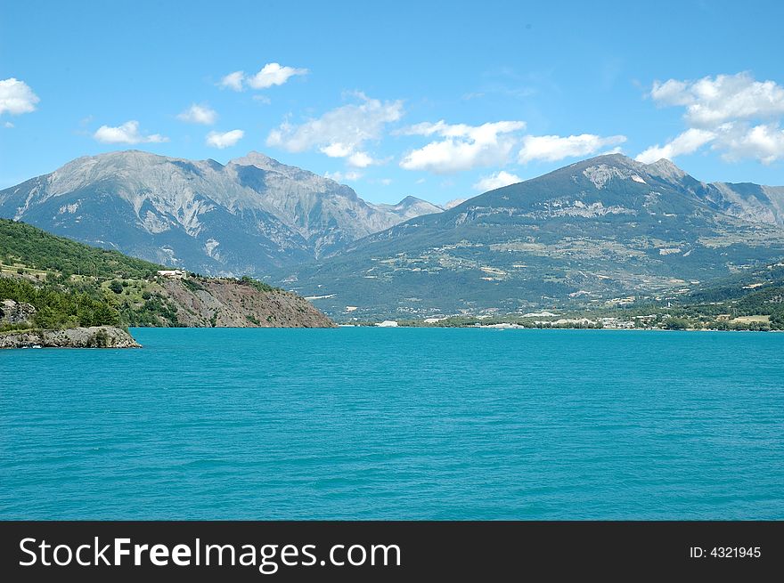 Serre-Poncon Lake, beneath the mountains of the Hautes-Alpes and the northern edge of the Alpes de Haute Provence, is the biggest artificial lake in Europe. One of its main caracteristic is its amazing blue color inherited from the water of Durance River. Serre-Poncon Lake, beneath the mountains of the Hautes-Alpes and the northern edge of the Alpes de Haute Provence, is the biggest artificial lake in Europe. One of its main caracteristic is its amazing blue color inherited from the water of Durance River.