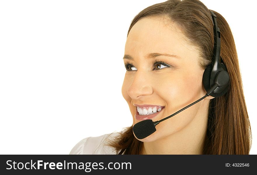 Smiling caucasian girl wearing headset as customer representative looking to the side. Smiling caucasian girl wearing headset as customer representative looking to the side