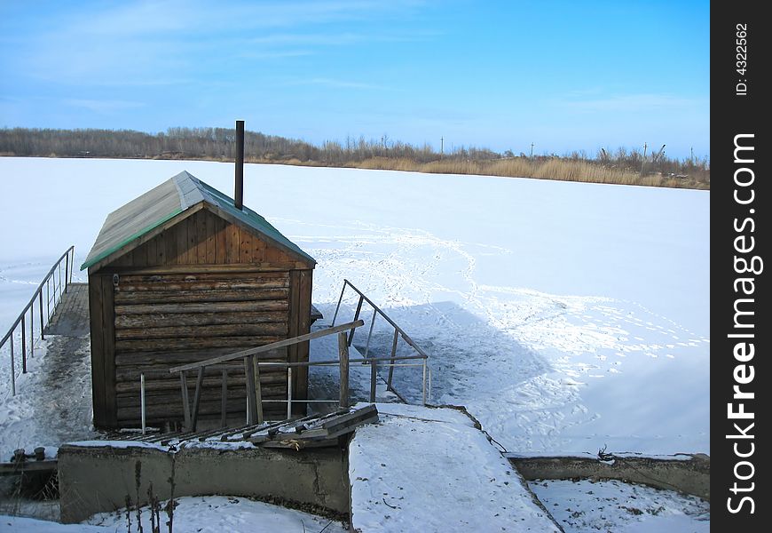 Wooden bathhouse on the lake. Wooden bathhouse on the lake