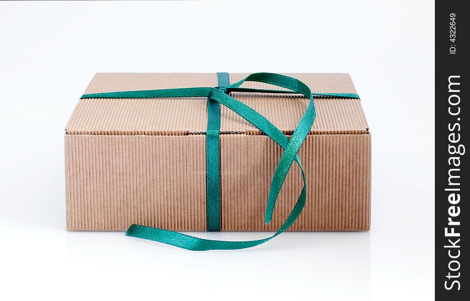 Easy to isolate closed paper box with green ribbon