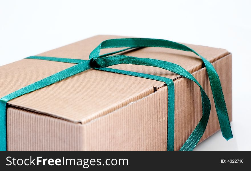 Easy to isolate closed paper box with green ribbon