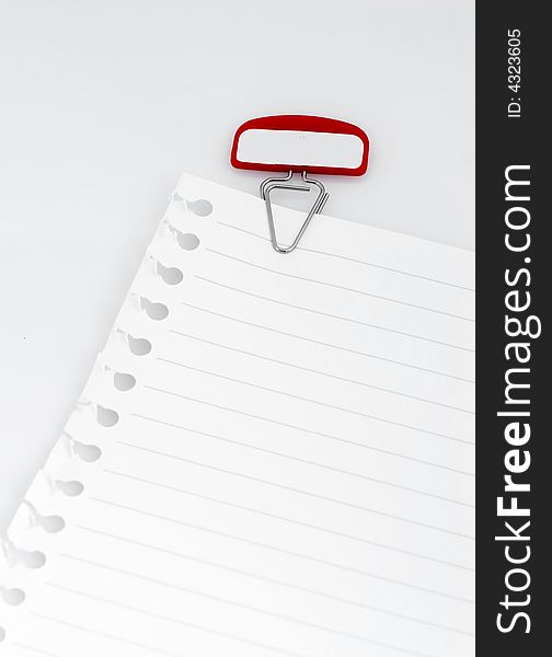 Note paper sheet with red paper clip