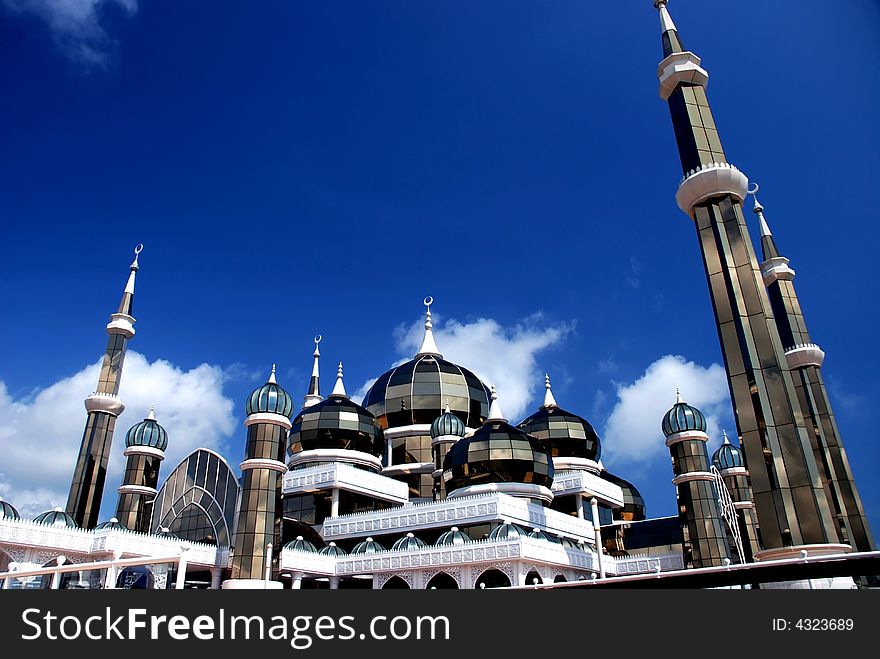 Mirror mosque on the blue sky background