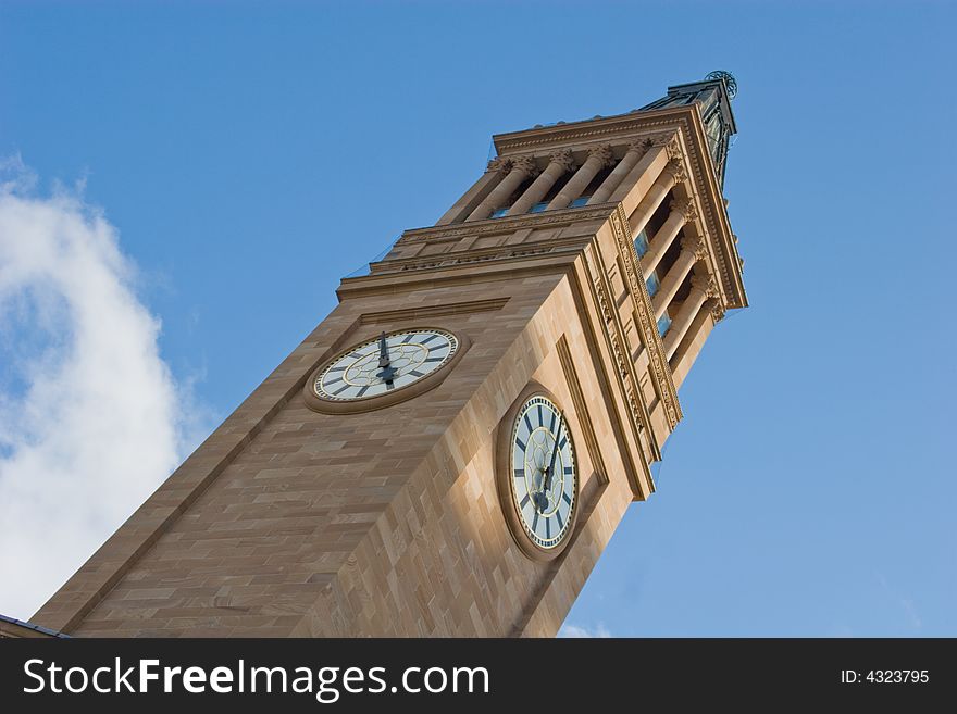 Brisbane City Hall clock tower against the blue sky. Brisbane City Hall clock tower against the blue sky