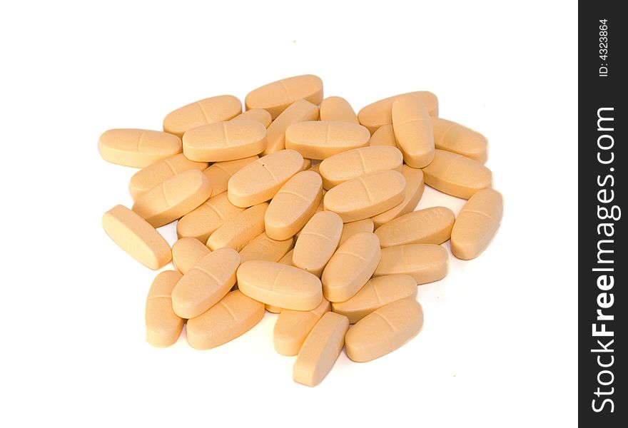 Pile of orange pills on white background. Pile of orange pills on white background