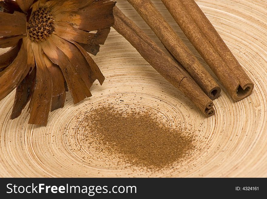 Cinnamons with flower on the bamboo platter