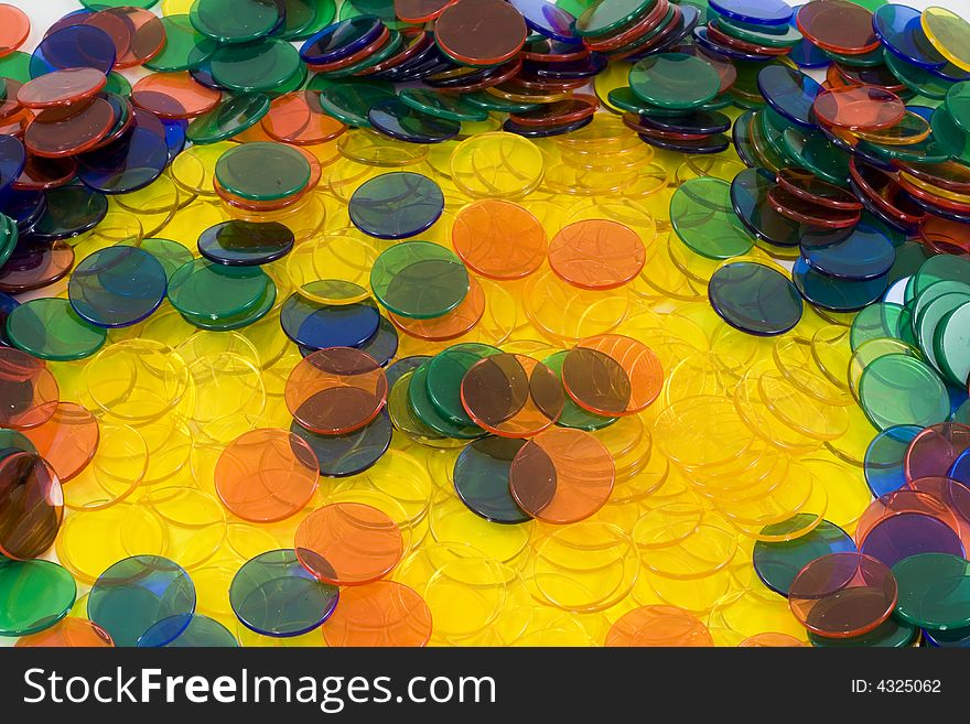 Colourfull Counters on a white background, mixed up colours