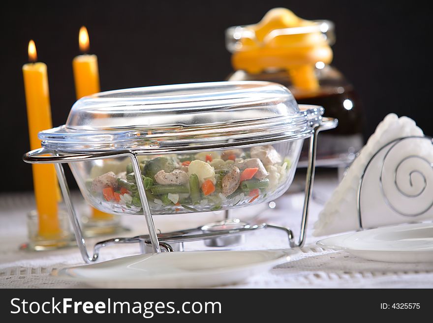 Dinner in oven-proof glass bowl on the table