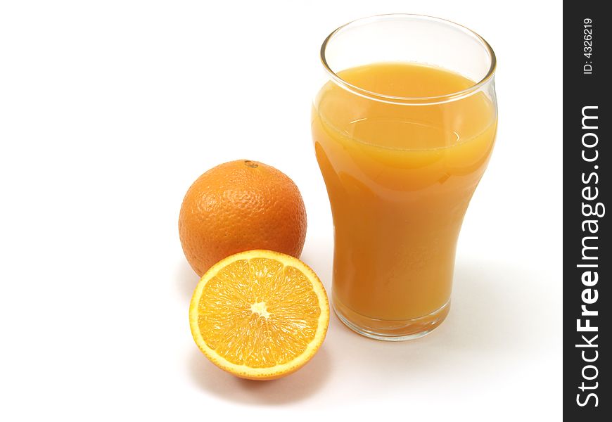 Oranges and glass of orange juice isolated on a white background