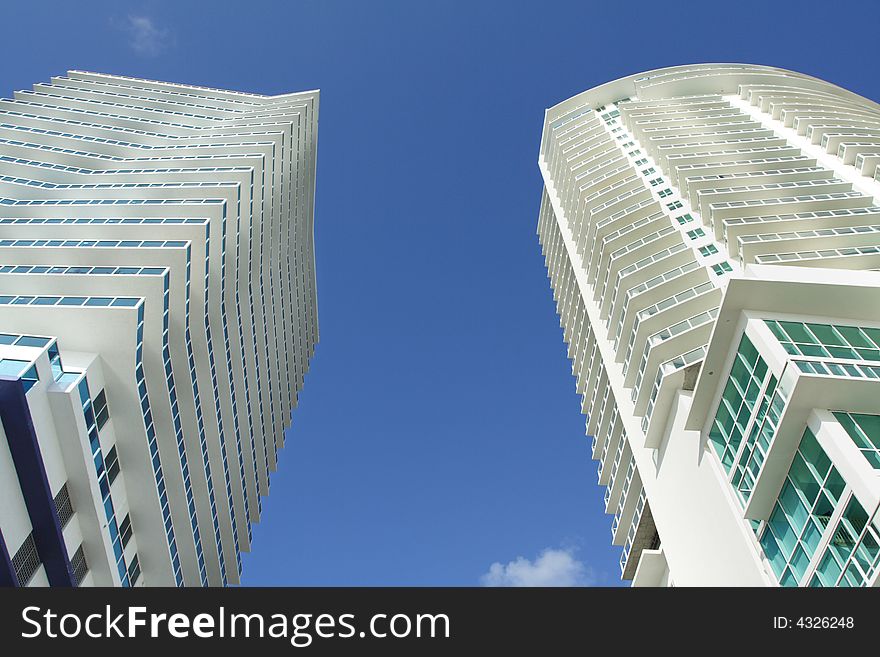 Futuristic abstract buildings on blue sky. Futuristic abstract buildings on blue sky