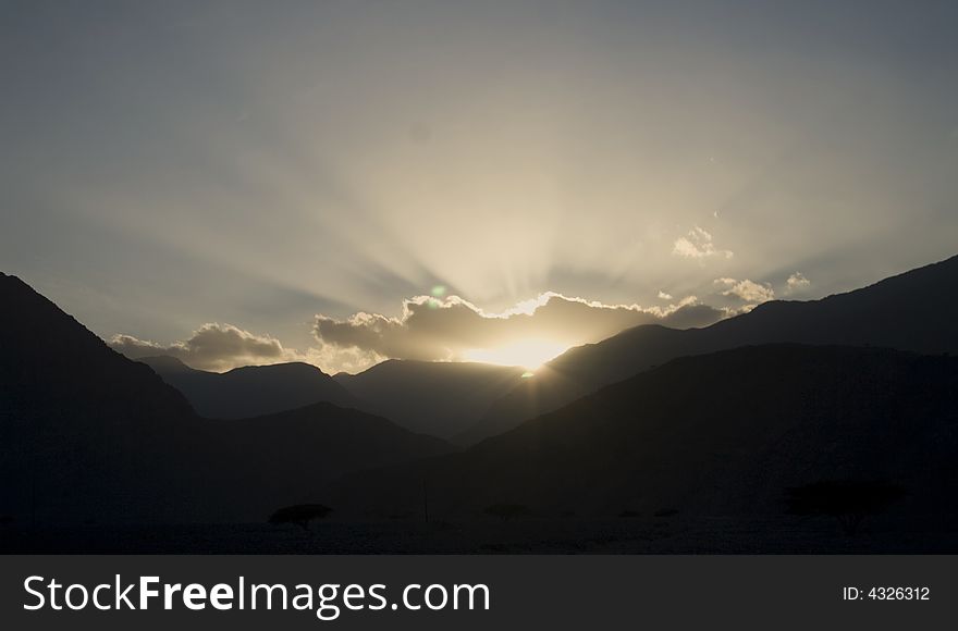 Sunset Behind Mountain