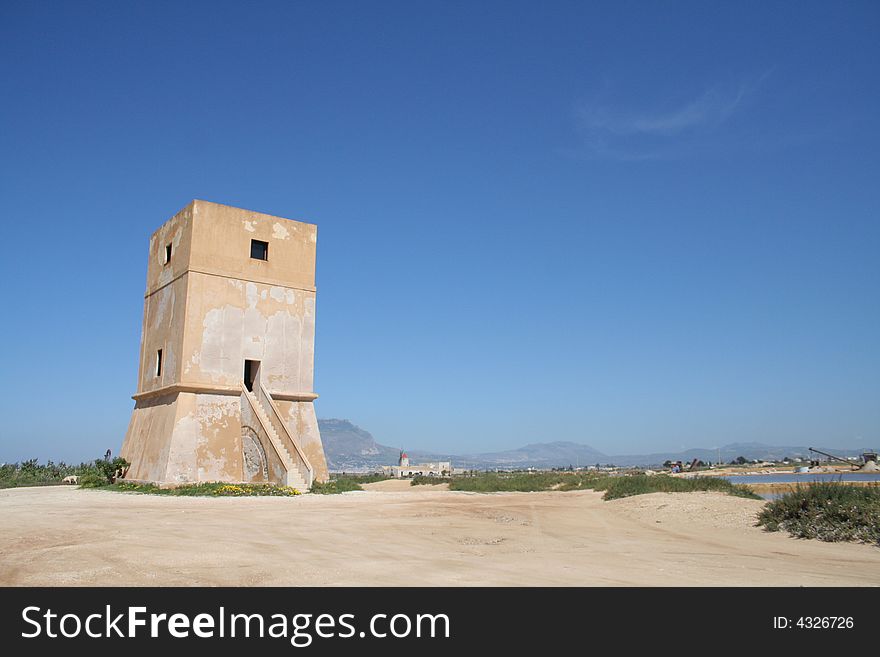 Old stone lighthouse near Trapani, Sicily, Itally