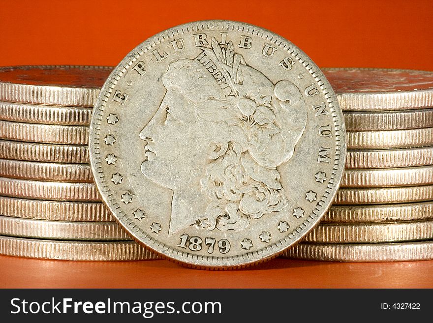 Closeup of two stacks of Morgan silver US dollars. Closeup of two stacks of Morgan silver US dollars.