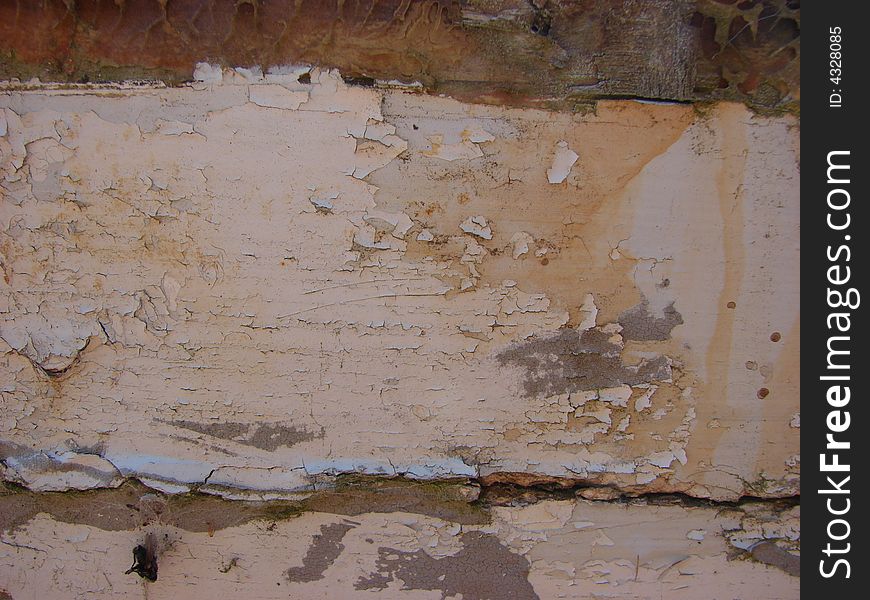 Old paint on board crackling and peeling off. Old paint on board crackling and peeling off.