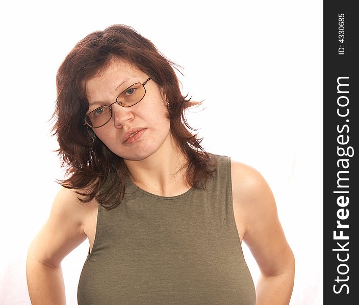 Portrait of the woman in a fitting vest on a white background.