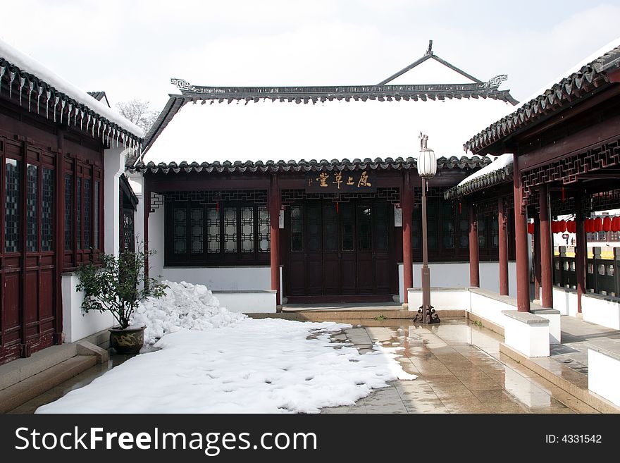 The beautiful and enjoyable snow scenery in the winter in the southern part of China. These sceneries are famous for their snow ,water, houses,and the blue sky.They are typical of the south in China.This picture is taken in the place of interestâ€œMooring by the Feng Bridge at nightâ€ in Suzhou ,China.