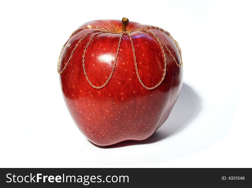 Red apple with golden chain. Red apple with golden chain