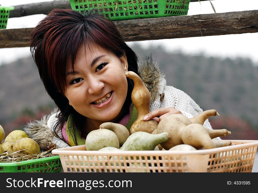 In autumn, the suburban happy girl in Beijing. Harvest of enjoying gold autumn.