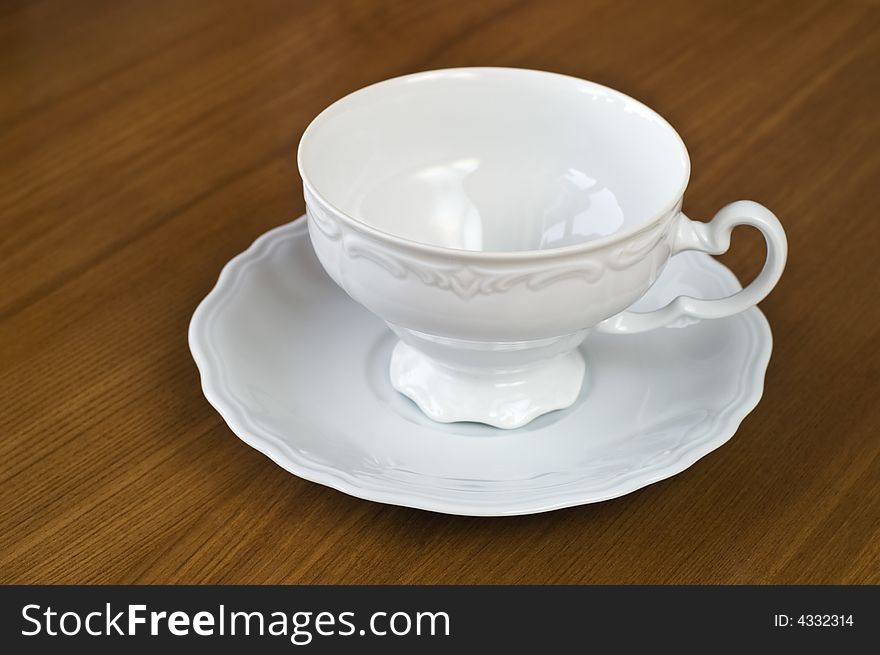 Empty White Cup On Wooden Table