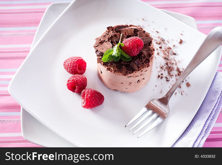 Chocolate Moose dessert on a white plate with milk