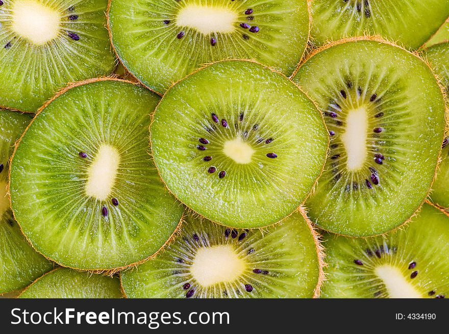 Green ripe kiwi slices wallpaper. Green ripe kiwi slices wallpaper