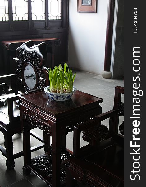 An ancient and graceful sitting room with mooden furniture.This picture is taken in the place of interestâ€œMooring by the Feng Bridge at nightâ€ in Suzhou ,China.