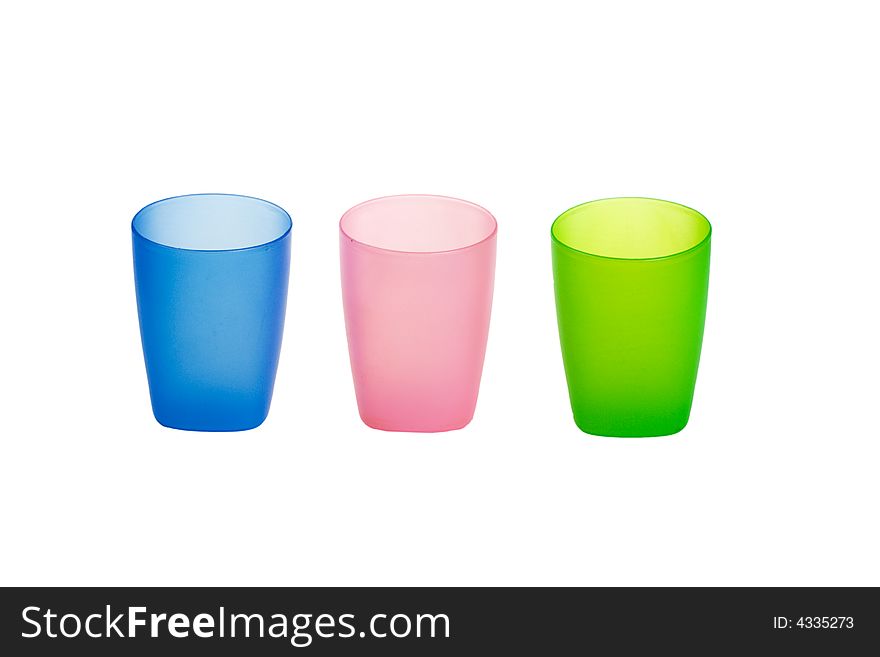 Three color plastic glasses isolated on a white background