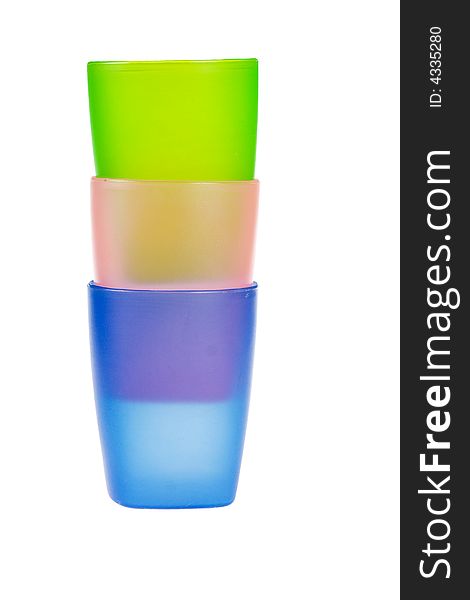 Three color plastic glasses isolated on a white background