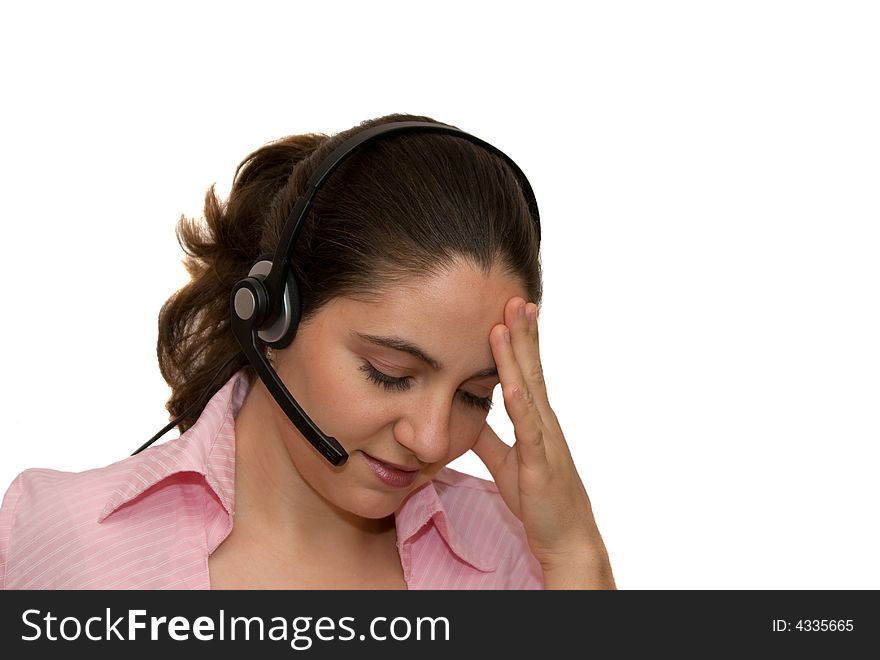 A girl, wearing headphones, looking a little bit tired and stressed. A girl, wearing headphones, looking a little bit tired and stressed