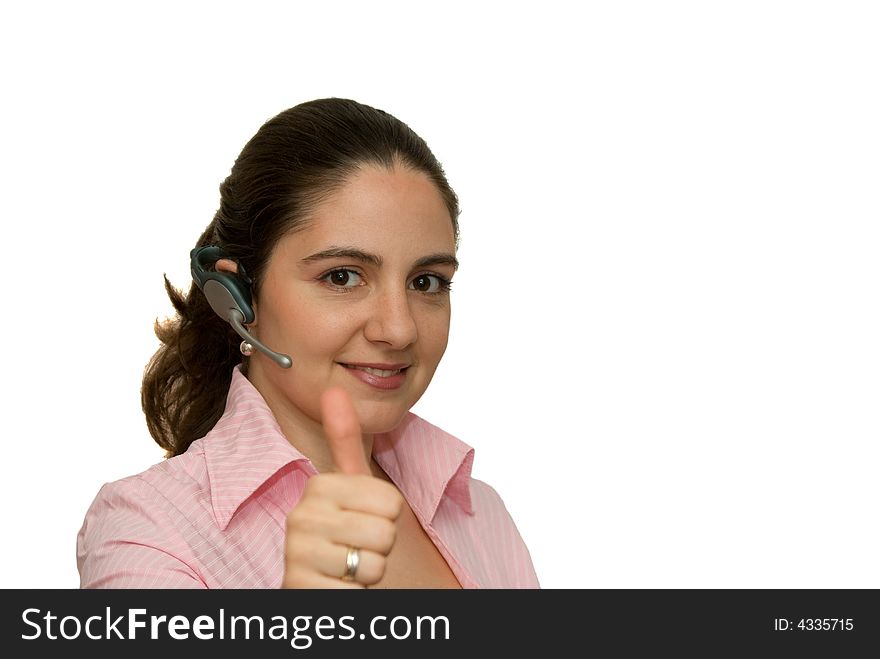 A girl, wearing bluetooth earpiece, holding her thumb up. A girl, wearing bluetooth earpiece, holding her thumb up