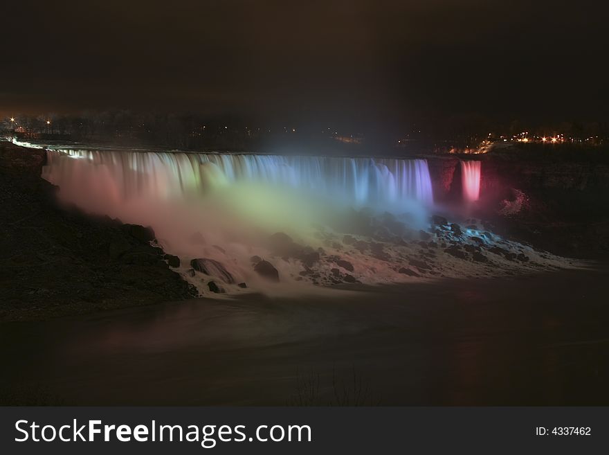 American Niagara Falls illuminated at night. American Niagara Falls illuminated at night