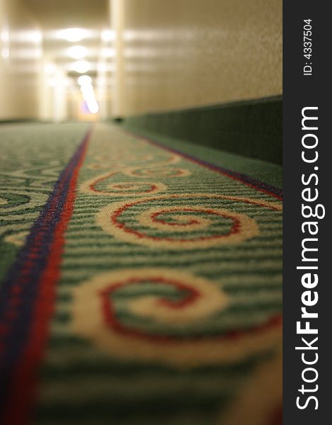 Detail of carpet in hallway of hotel or motel. Detail of carpet in hallway of hotel or motel