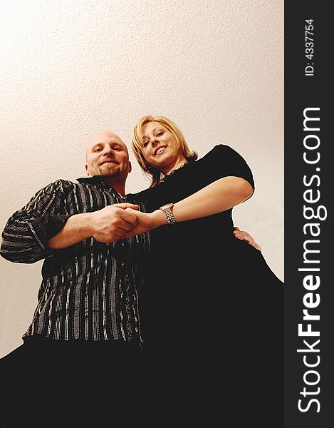 Young lovers standing in an studio for light blue background and the camera.
is lying on there feet. Young lovers standing in an studio for light blue background and the camera.
is lying on there feet.