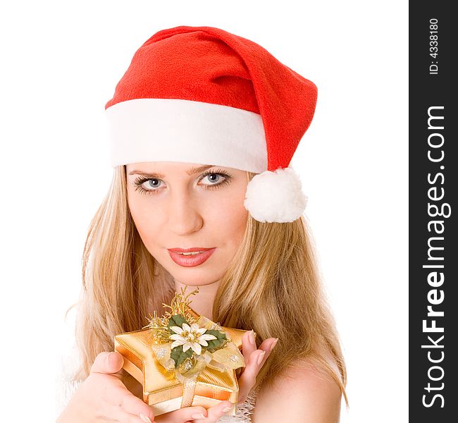 Winter portrait of a beautiful young smiling woman with a gift in her hands. Over white background. Winter portrait of a beautiful young smiling woman with a gift in her hands. Over white background